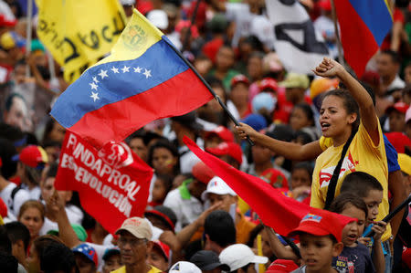 Supporters of Venezuela's President Nicolas Maduro attend his closing campaign rally in Caracas, Venezuela, May 17, 2018. REUTERS/Carlos Garcia Rawlins