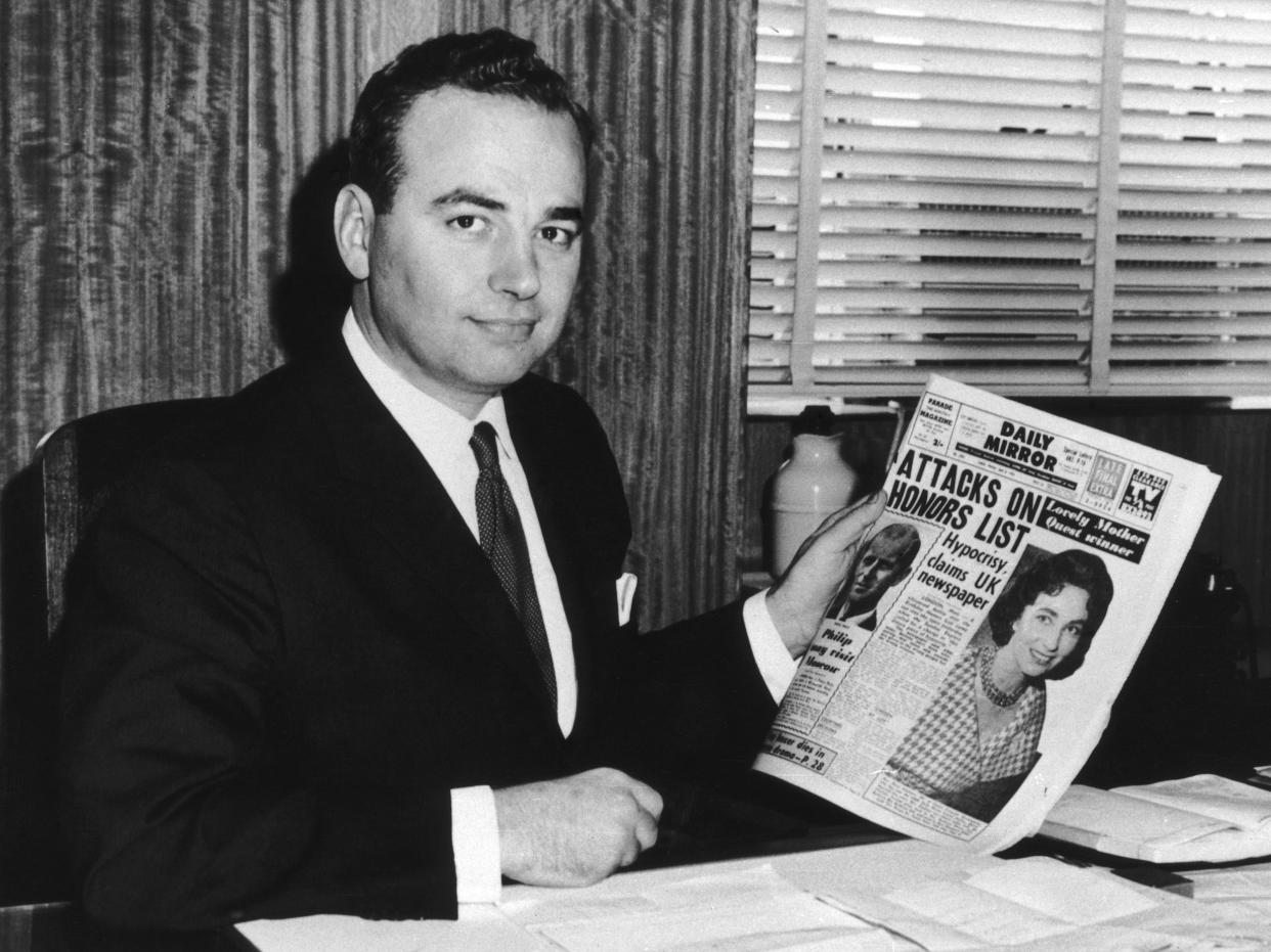 Rupert Murdoch holding a copy of the Daily Mirror, a Sydney tabloid, taken in May 1960.