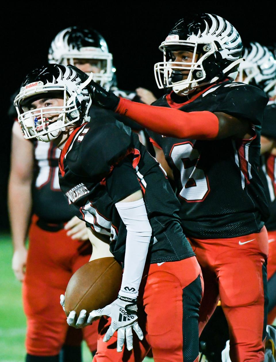 Eastern Greene’s Lane Stephens (11) and James Lewis (6) celebrate after a long punt return during the football game against Clarksville at Eastern Greene on Friday, Sept. 15, 2023.