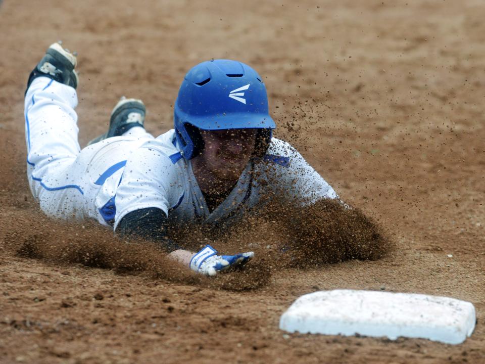 Zanesville's Clayton Tredway slides into third base during a 12-0 loss to visiting Philo on Friday at Jay Payton Field in Zanesville. The Blue Devils will host Belmont Union Local in the Division II sectional tournament.
