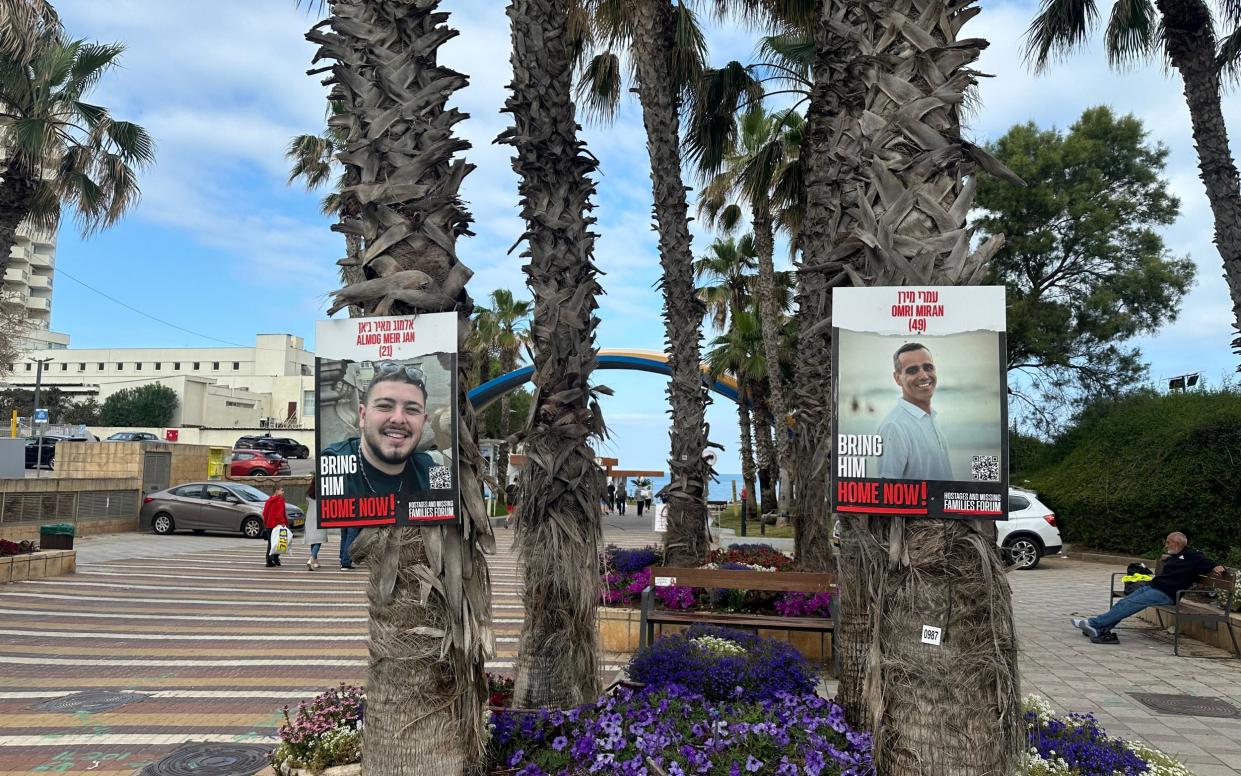 Photographs of the Israelis held hostage in Gaza greet beachgoers at Herzliya