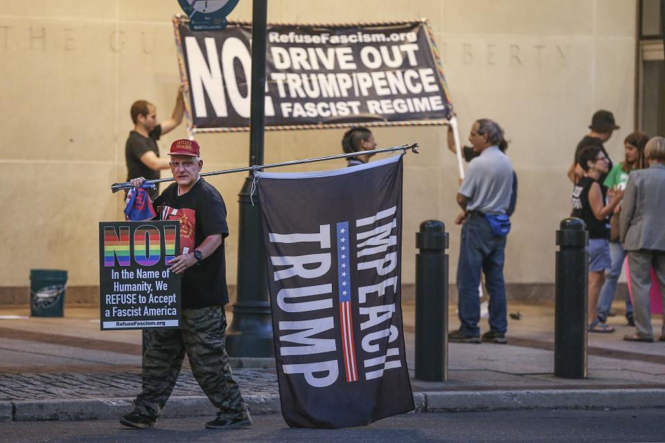 <p>Anthoney Novotny, from Havertown, marches with a group called Refuse Fascism, as they protest President Donald Trump’s nomination for the Supreme Court, Judge Brett Kavanaugh, in front of the Philadelphia Federal Courthouse, Monday, July 9, 2018. (Photo: Steven M. Falk/The Philadelphia Inquirer via AP) </p>