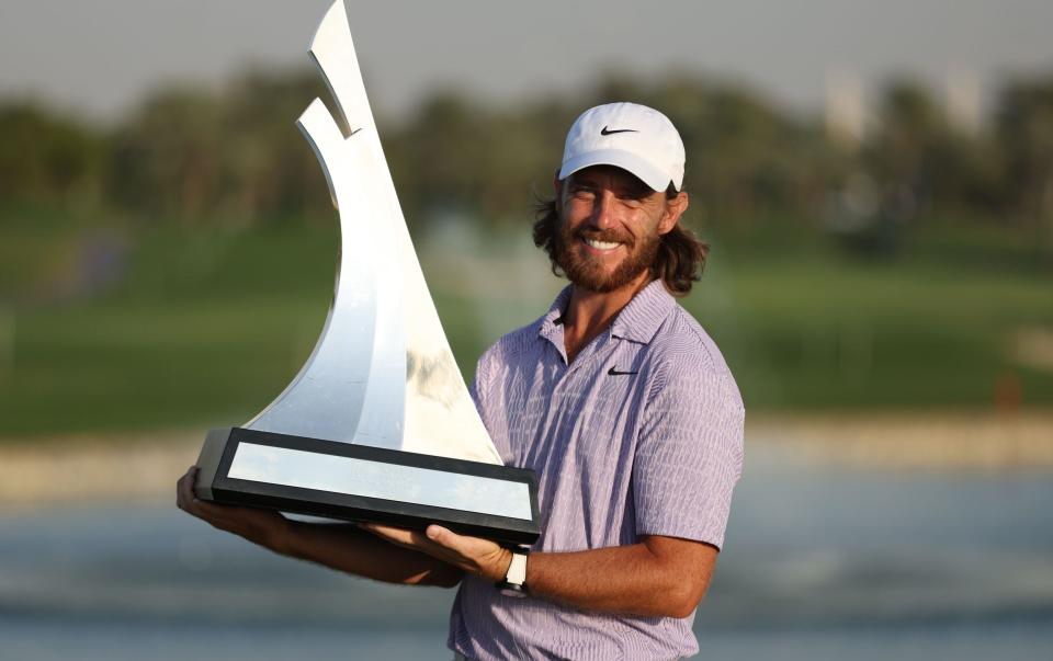 Tommy Fleetwood holding the trophy