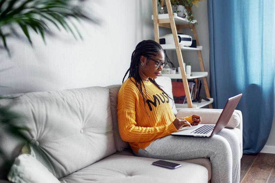 woman filing taxes on her laptop