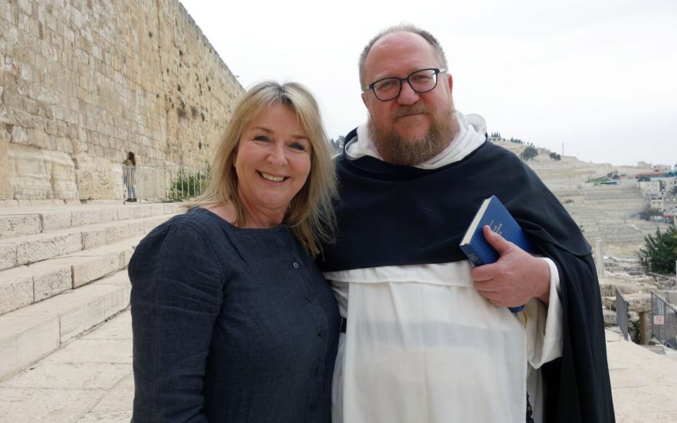Fern with Father Gregory Tatum in front of Temple Mount - Credit: Ronen Mayo/BBC Pictures