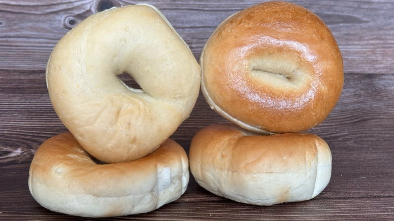 Bagels stacked on wood background
