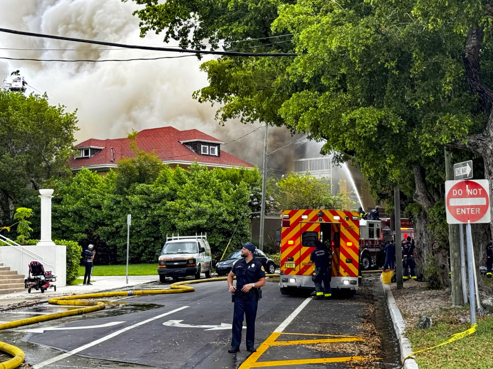 Miami Fire Rescue and Miami police work at the scene of the fire at the Temple Court Apartments, Monday, June 10, 2024 in Miami. (Carl Juste/Miami Herald via AP)