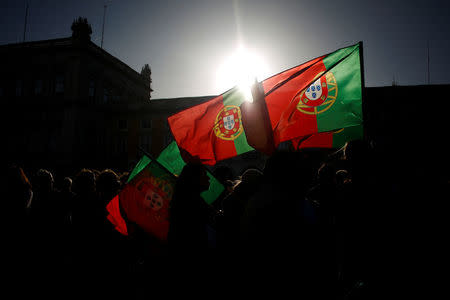 People demonstrate in a tribute to the victims of the deadly fires in Portugal, in Praca do Comercio square, downtown Lisbon, Portugal October 21, 2017. REUTERS/Pedro Nunes