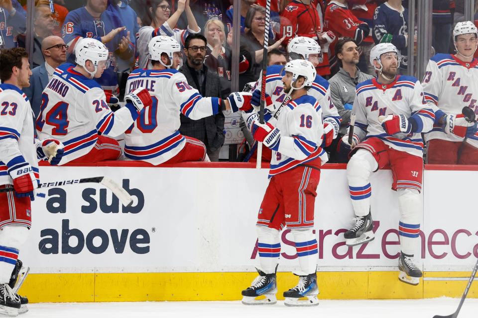 New York Rangers center Vincent Trocheck (16) celebrates with teammates after scoring a goal against the Washington Capitals in the first period of Game 4.