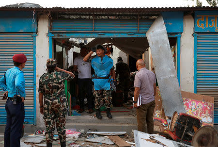 Security personnel inspect an explosion site in Kathmandu, Nepal May 26, 2019. REUTERS/Navesh Chitrakar