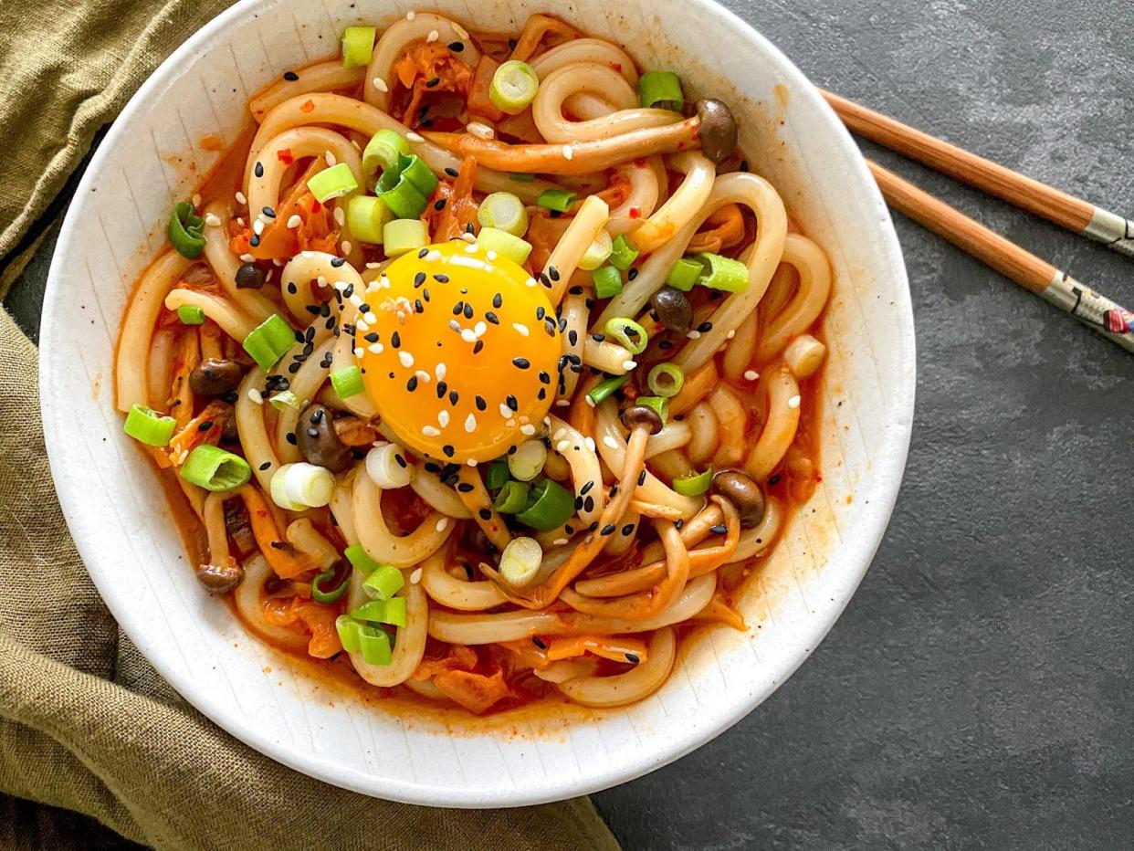 <p>Lip-smacking: Kimchi and udon noodles are a fantastic combination in this creamy, gochujang-infused dish</p> (Verna Gao)