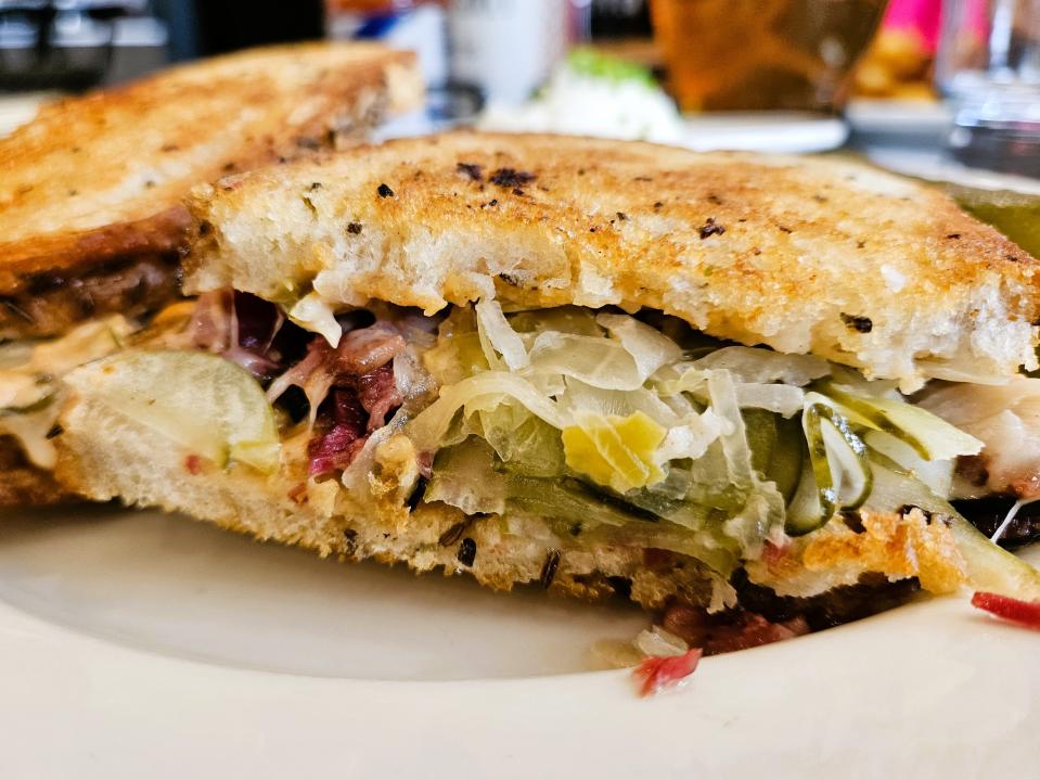 The 1871 sandwich at Palm Avenue Deli in downtown Sarasota contains pastrami, sauerkraut, Swiss, dill pickles and Thousand island dressing. This one was photographed Oct. 14, 2023.