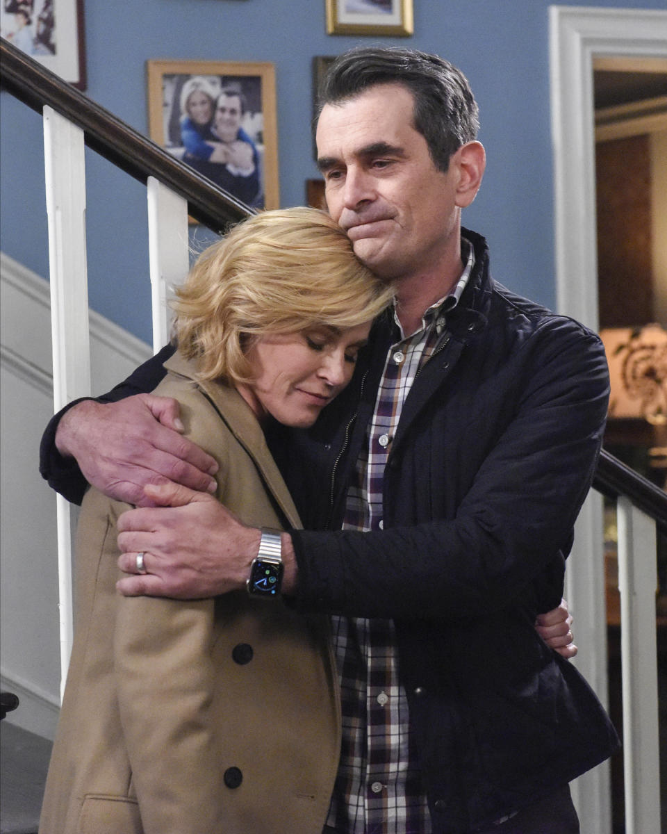 This image released by ABC shows Julie Bowen, left, and Ty Burrell in a scene from the series finale of "Modern Family. The popular comedy series ends its 11-season run with a two-hour finale on Wednesday. (Bonnie Osborne/ABC via AP)