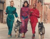 <p>Three models showcase their colorful power suits while going for a casual walk down the street. </p>