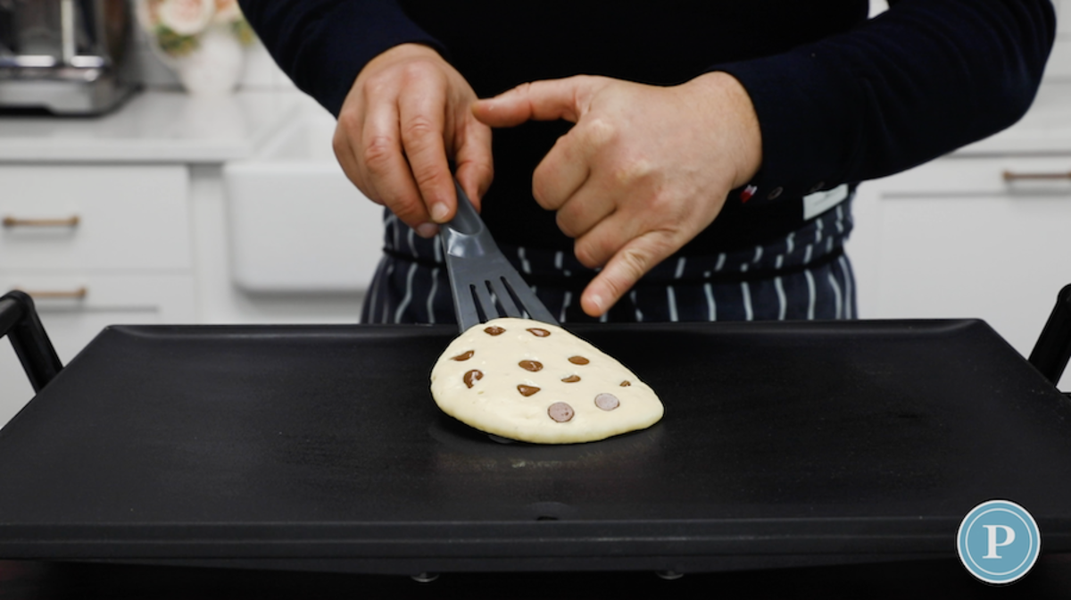 If you're adding ingredients to your pancakes (like blueberries, chocolate chips or sausage), add them to the batter before flipping.<p>Parade</p>