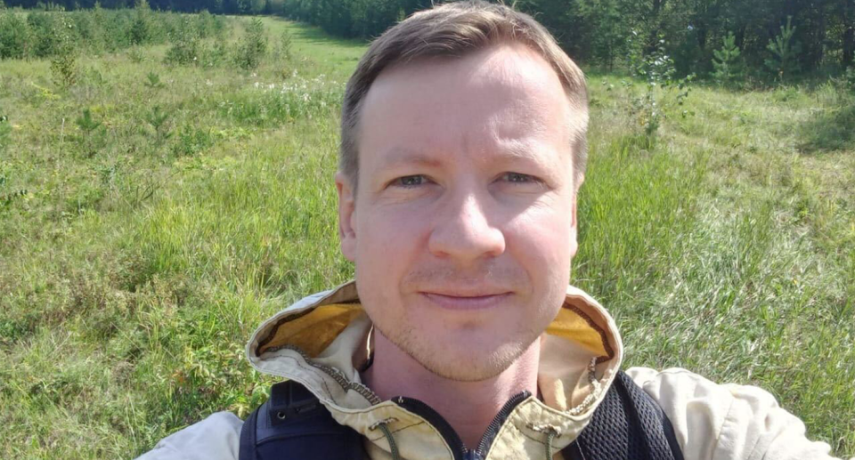 Evgenii Krestianinov standing in a field.