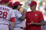 St. Louis Cardinals pitching coach Mike Maddux, right, talks to starting pitcher Carlos Martinez during the third inning of a baseball game against the Chicago Cubs in Chicago, Sunday, June 13, 2021. (AP Photo/Nam Y. Huh)