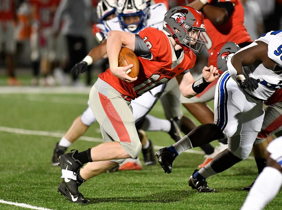 Vineland QB Daniel Russo (10) runs for a gain against visiting Williamstown on Friday night. The Braves defeated Vineland 28-6 at Gittone Stadium. Oct. 22, 2021.