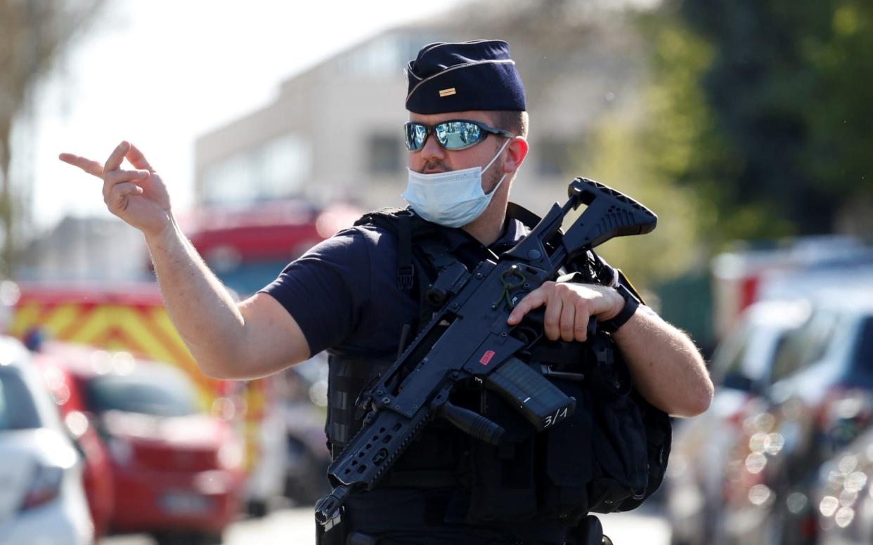 Police secure the area where an attacker stabbed a woman, in Rambouillet - GONZALO FUENTES /REUTERS