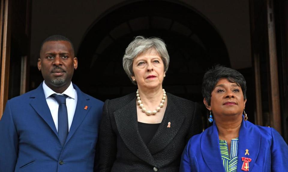 Theresa May with Stuart and Doreen Lawrence outside the memorial service.