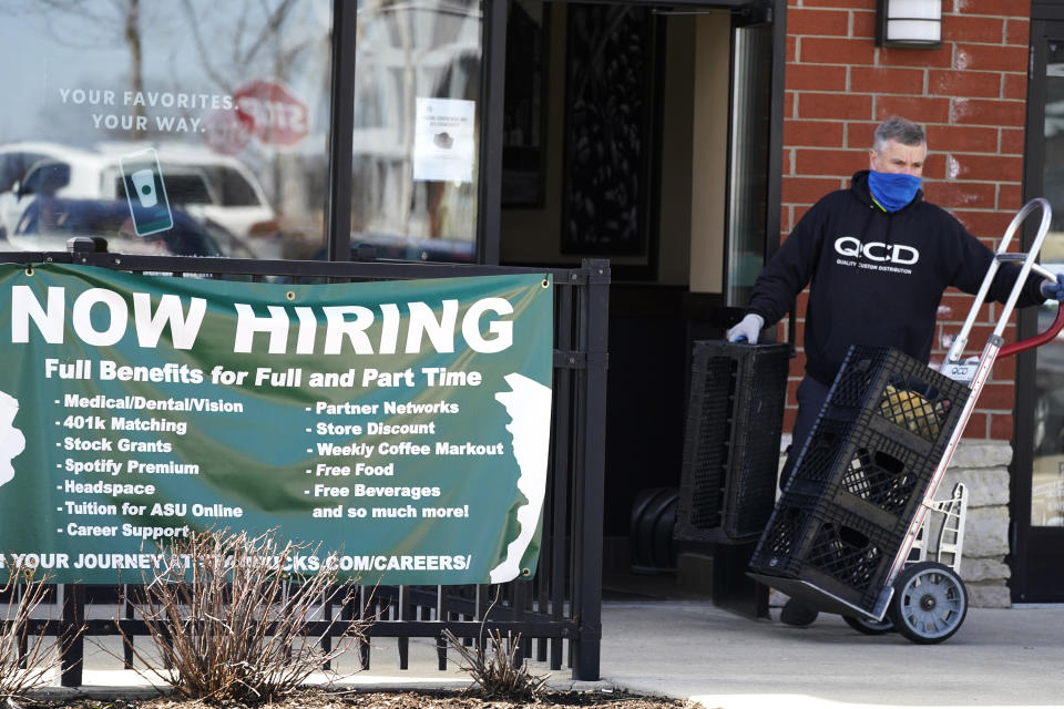 A hiring sign is displayed outside of a Starbucks in Schaumburg, Ill., Friday, April 1, 2022. America's employers added a healthy number of jobs last month, Friday, Sept. 2, yet slowed their hiring enough to potentially help the Federal Reserve in its fight to reduce raging inflation. The economy gained 315,000 jobs in August, a still-solid figure that pointed to an economy that remains resilient despite rising interest rates, high inflation and sluggish consumer spending. (AP Photo/Nam Y. Huh)