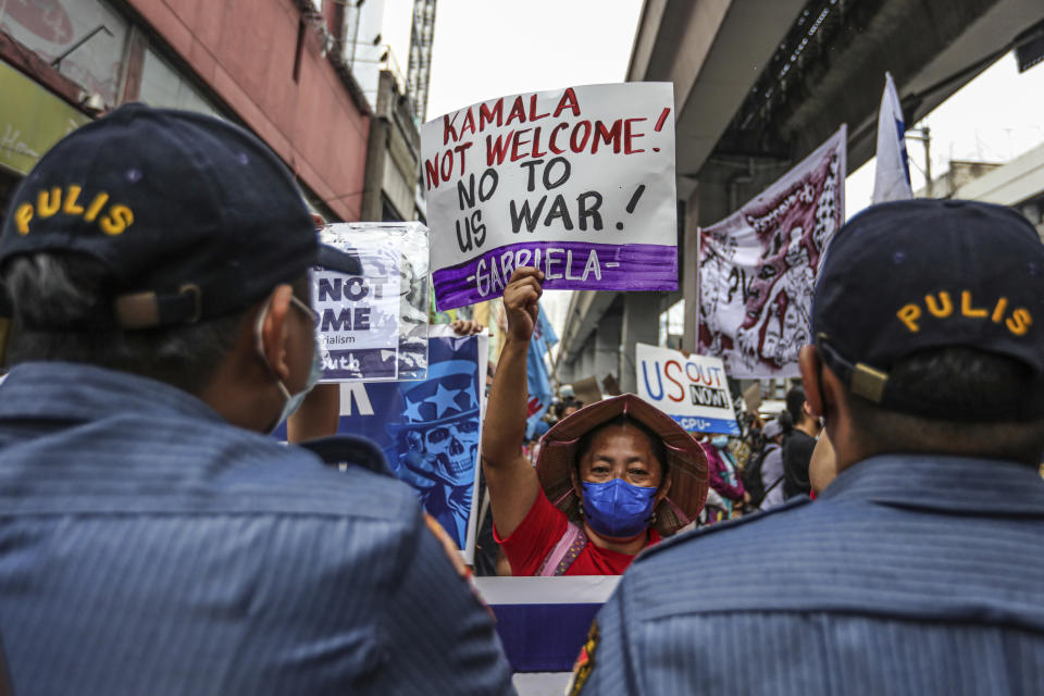 Protesters hold a rally as they tried to march near Malacanang Palace against the visit of U.S. Vice President Kamala Harris in Manila Monday, Nov. 21. 2022. (AP Photo/Gerard V. Carreon)