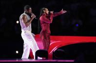 Usher, left, and Alicia Keys perform during halftime of the NFL Super Bowl 58 football game between the San Francisco 49ers and the Kansas City Chiefs, Sunday, Feb. 11, 2024, in Las Vegas. (AP Photo/Eric Gay)