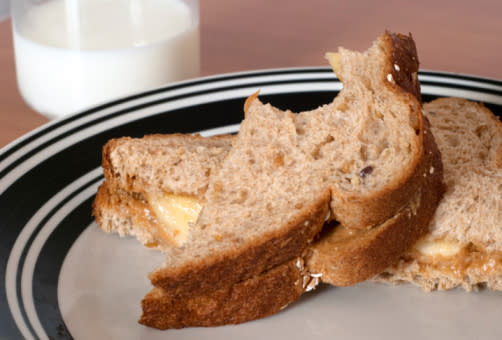 A peanut butter and banana sandwich on whole grain toast.