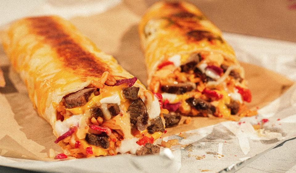 The Double Steak Grilled Cheese Burrito ($3.49), back on Taco Bell's menu for a limited time, is loaded with twice the serving of grilled marinated steak as a Steak Quesadilla), along with seasoned rice and sauce in a warm tortilla, topped with a melted mix of cheddar, mozzarella and pepper jack cheeses and then grilled.