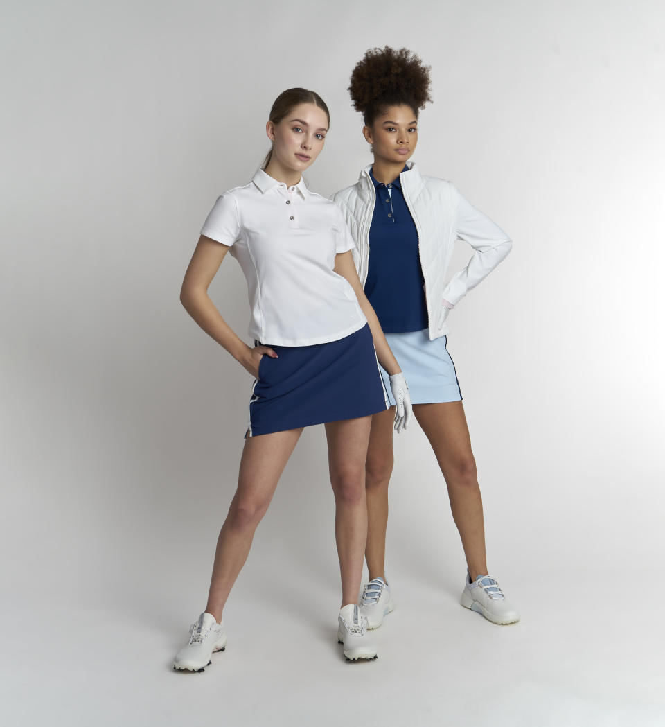 Models wear the Lexi polos, Carli skorts and Whitney two-in-one jacket.