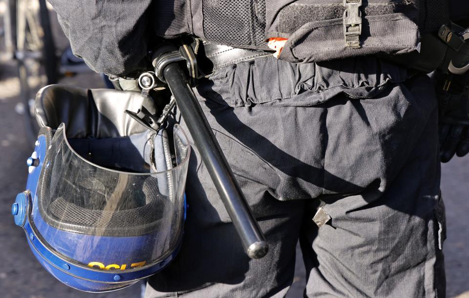 England, London, Parliament Square, Riot police and public order police, helmet and baton.