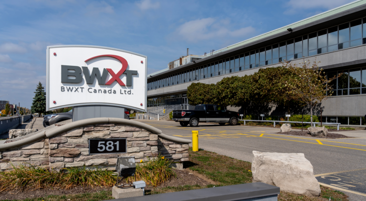 The logo for BWX Technologies (BWXT) is shown on a sign outside of an office building.