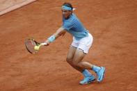 Tennis - French Open - Roland Garros - Rafael Nadal of Spain vs Facundo Bagnis of Argentina. - Paris, France - 26/05/16. Nadal returns the ball. REUTERS/Pascal Rossignol