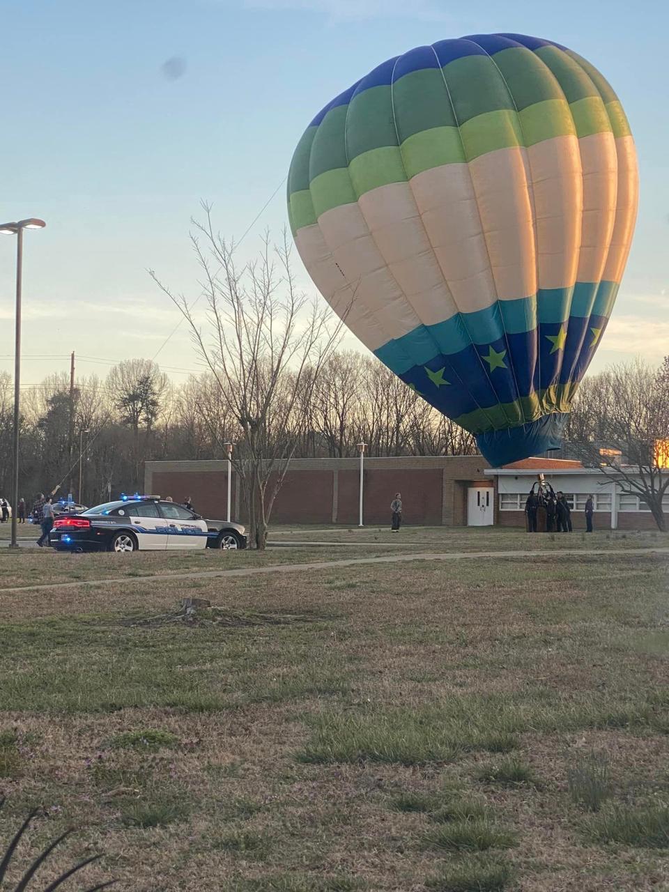 A hot-air balloon touches down in an emergency landing Sunday, March 5, 2023 at Carter G. Woodson Middle School in Hopewell. No injuries were reported, and the scene was cleared quickly.