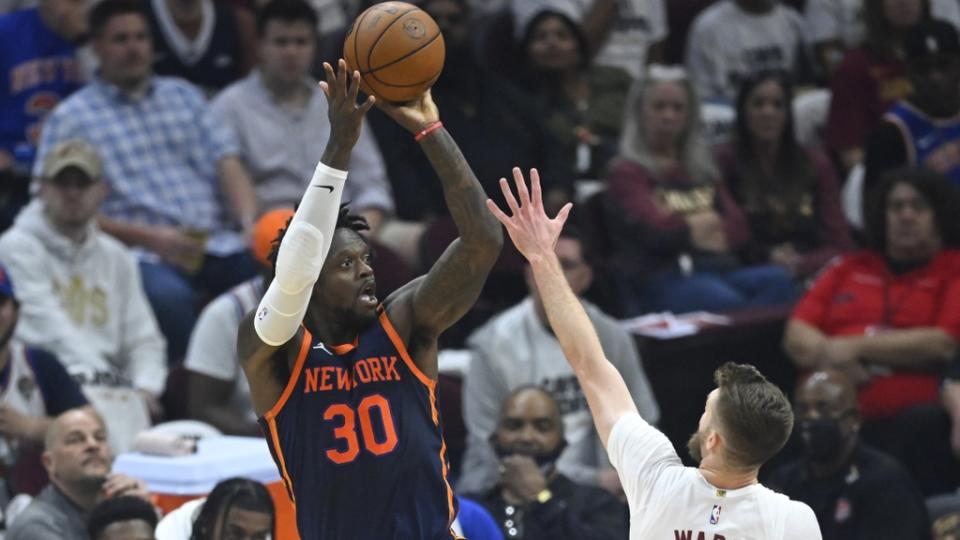 Apr 15, 2023; Cleveland, Ohio, USA; New York Knicks forward Julius Randle (30) shoots beside Cleveland Cavaliers forward Dean Wade (32) in the second quarter of game one of the 2023 NBA playoffs at Rocket Mortgage FieldHouse.