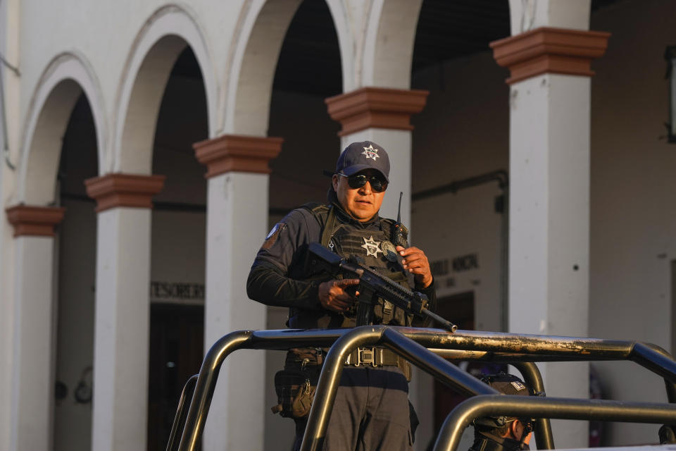 Police guard the City Hall in Maravatio, Michoacan state, Mexico, on Tuesday, Feb. 27, 2024. Two mayoral hopefuls in this city were gunned down the previous day within hours of each other. (AP Photo/Fernando Llano)