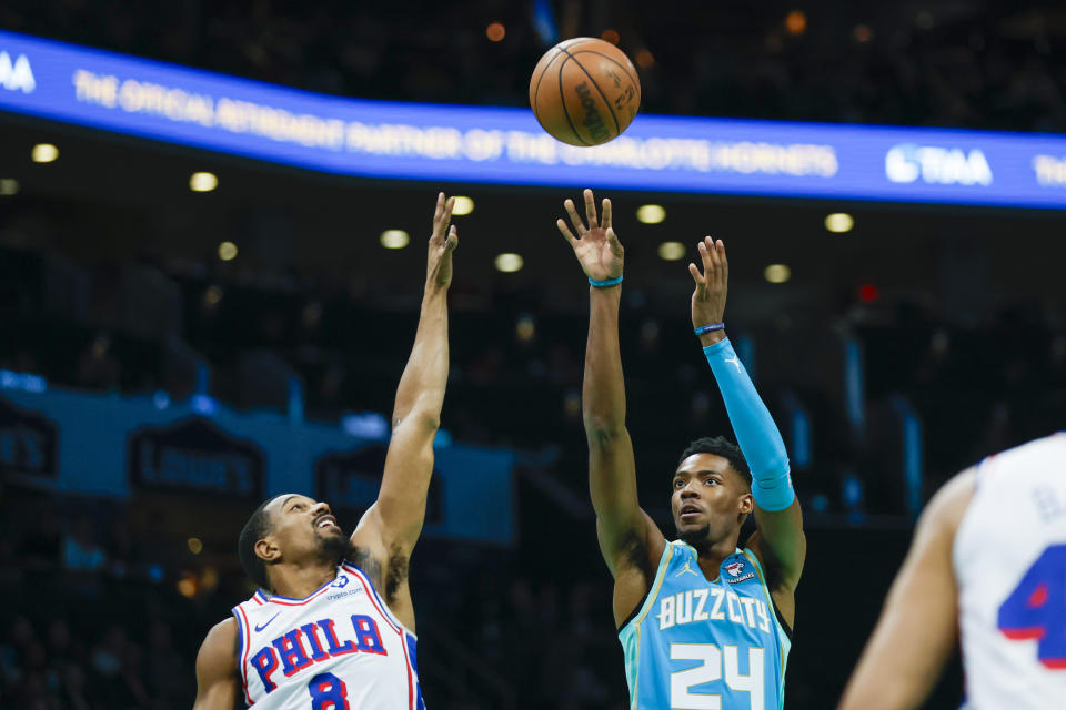 Charlotte Hornets forward Brandon Miller (24) shoots over Philadelphia 76ers guard De'Anthony Melton (8) during the first half of an NBA basketball game in Charlotte, N.C., Saturday, Dec. 16, 2023. (AP Photo/Nell Redmond)