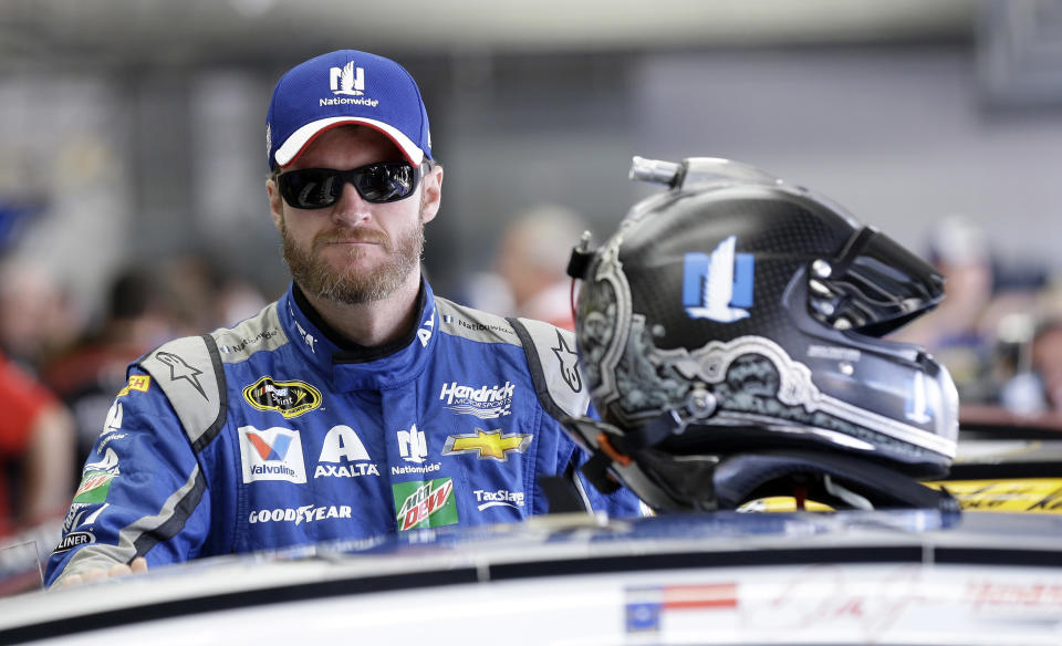 FILE - In this Saturday, May 28, 2016. file photo, Dale Earnhardt Jr. waits to get into his car prior to practice for Sunday's NASCAR Sprint Cup Series auto race at the Charlotte Motor Speedway in Concord, N.C. NASCAR television analyst and former driver Dale Earnhardt Jr. was taken to a hospital after his plane crashed in east Tennessee. (AP Photo/Gerry Broome)