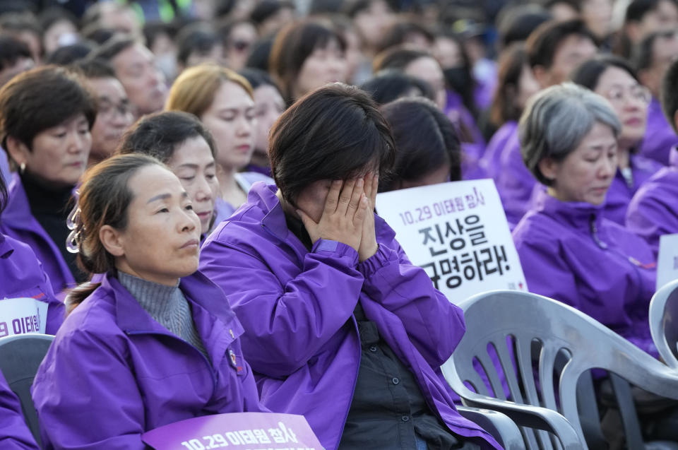 A family member of a victim weeps during a rally to mark the first anniversary of the harrowing crowd surge that killed about 160 people in a Seoul alleyway, at the Seoul Plaza in Seoul, South Korea, Sunday, Oct. 29, 2023. (AP Photo/Ahn Young-joon)