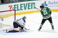 Dallas Stars left wing Jason Robertson scores against St. Louis Blues goaltender Jordan Binnington during the shootout in an NHL hockey game in Dallas, Wednesday, April 17, 2024. The Stars won 2-1. (AP Photo/Tony Gutierrez)