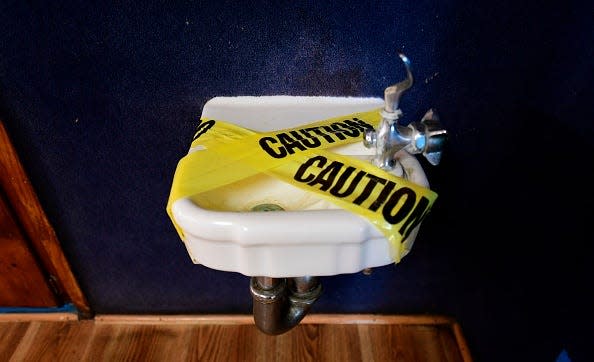 A water fountain is covered with tape and inaccessible as per coronavirus guidelines, during summer school sessions at Happy Day School in Monterey Park, California on July 9, 2020. California Governor Gavin Newsom says the reopening of California schools for the coming school year will be based on safety and not pressure from President Donald Trump as California sets records for one-day increases in COVID-19 cases.