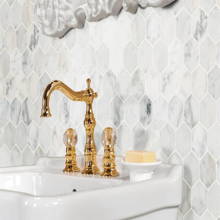 The honeycomb tile used as a backsplash behind a sink