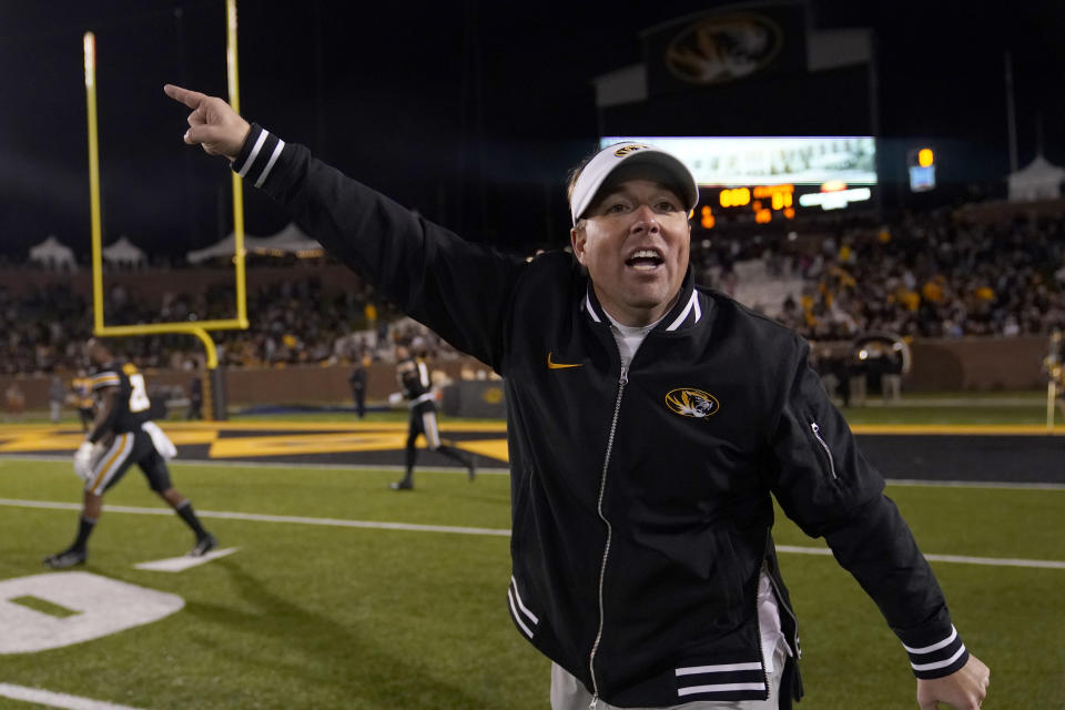 Missouri head coach Eliah Drinkwitz yells at his team to get back on the field to play one more down with a second on the clock during the second half of an NCAA college football game against Florida Saturday, Nov. 18, 2023, in Columbia, Mo. Missouri won 33-31. (AP Photo/Jeff Roberson)