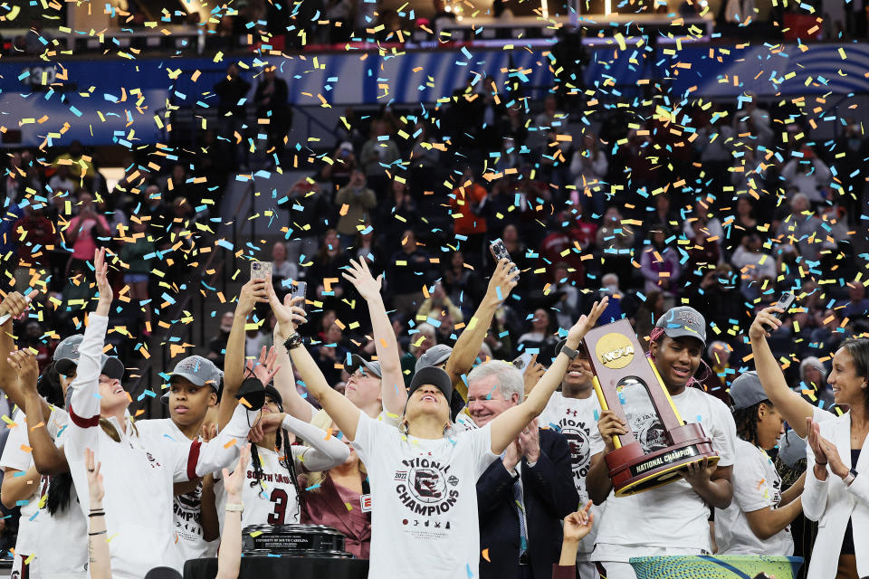 South Carolina head coach Dawn Staley and the Gamecocks celebrate during the national championship trophy presentation after defeating the UConn Huskies 64-49 in the 2022 NCAA women's tournament on April 3, 2022 at Target Center in Minneapolis. (Andy Lyons/Getty Images)