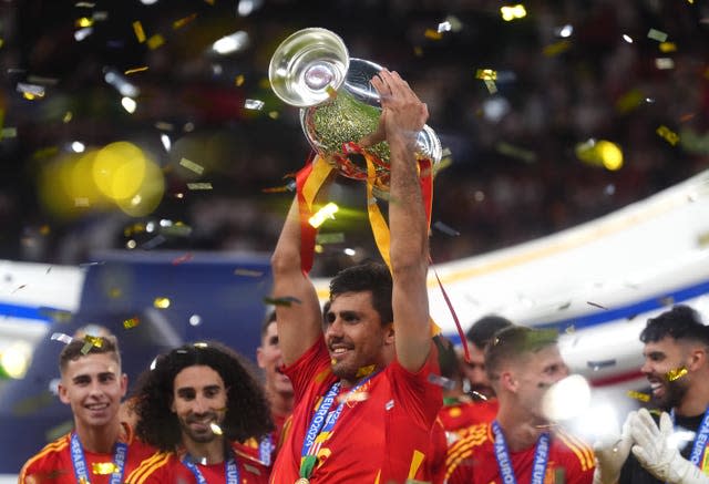 Rodri lifts the European Championship trophy with his Spain teammates