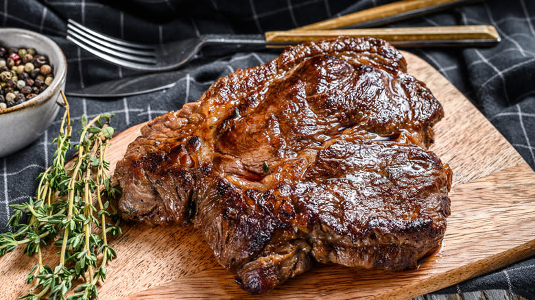 Beef chuck roast meat on board