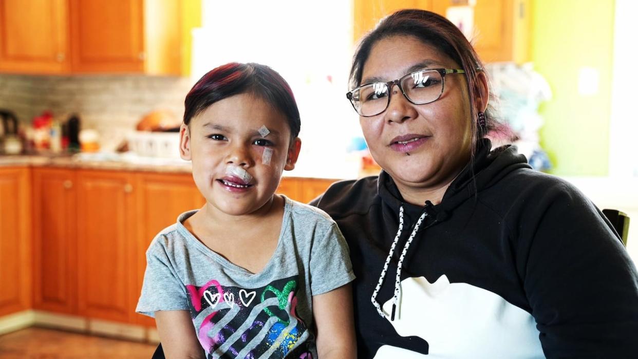 Mary-Lou Nuna says her daughter Melina Rich is resting at home after the six-year-old was attacked by a stray dog in Sheshatshiu in April. (Heidi Atter/CBC - image credit)