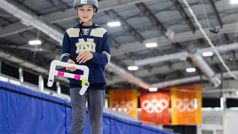 Ethan Marcheschi, 10, learns to curl at the Utah Olympic Oval in Kearns on June 16, 2023.