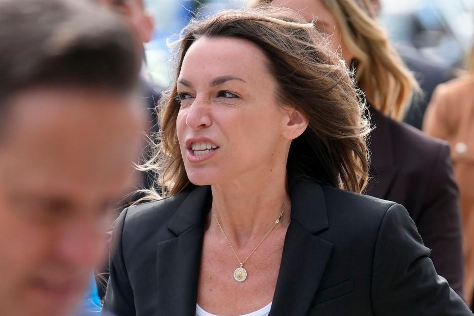 Karen Read, center, arrives at Norfolk Superior Court, Monday, July 1, 2024, in Dedham, Mass. Read is on trial, accused of killing her boyfriend Boston police Officer John O'Keefe, in 2022. The jury began deliberations in the trial Tuesday, June 25. (AP Photo/Steven Senne)