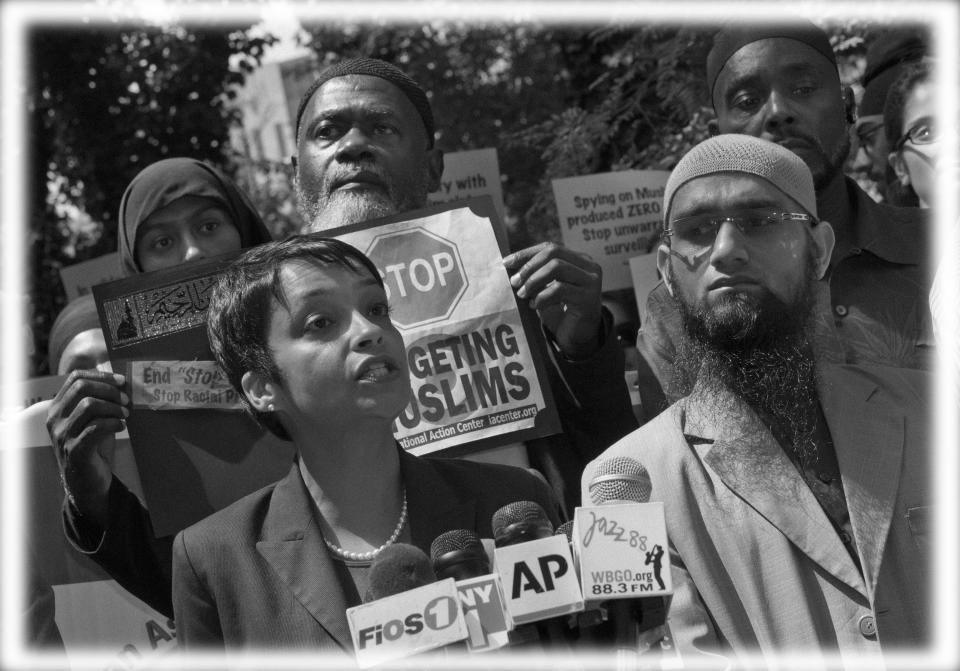 Hina Shamsi, left, director of the ACLU's National Security Project, addresses the media on a plaza in front of New York City Police Department headquarters in 2013. (Photo: Richard Drew/AP; digitally enhanced by Yahoo News)